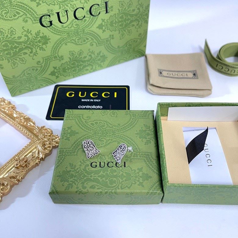 G*u*i earrings